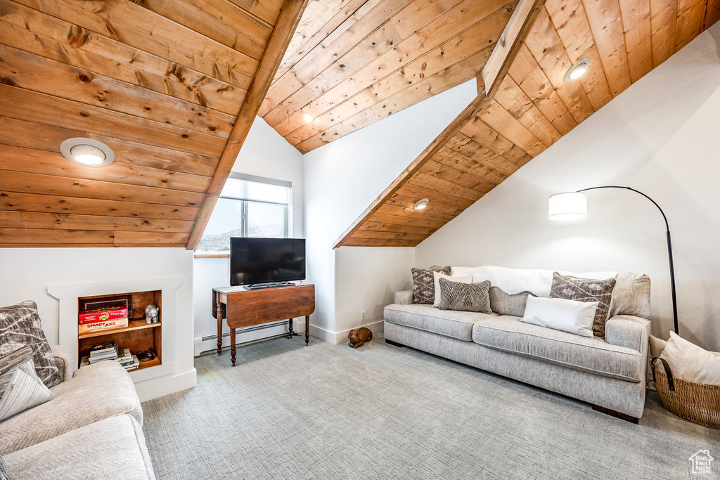 Living room featuring wood ceiling, lofted ceiling, and a baseboard radiator