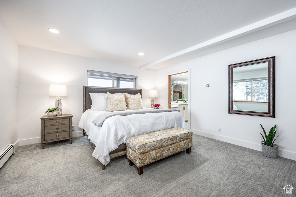Carpeted bedroom featuring baseboards, a baseboard radiator, and recessed lighting