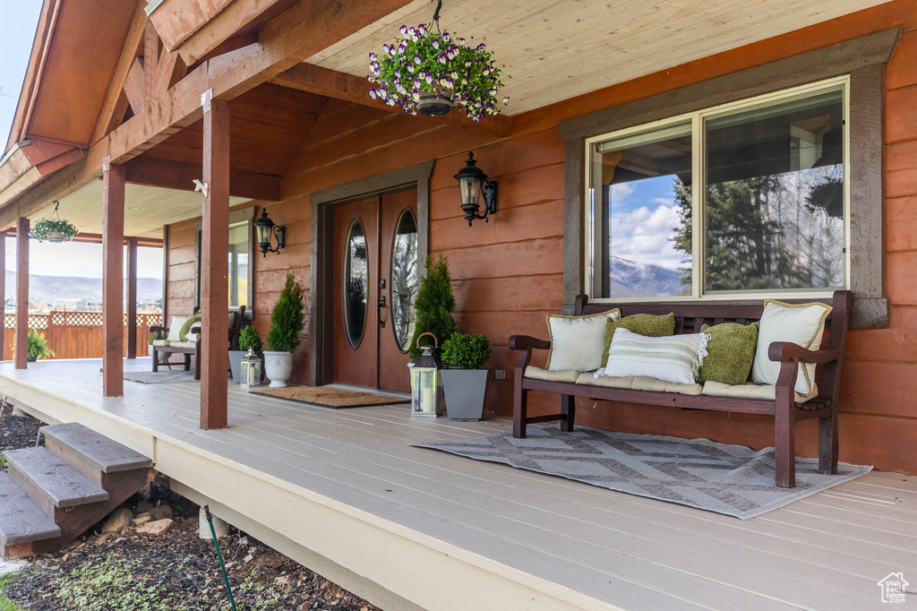 Wooden terrace featuring a porch