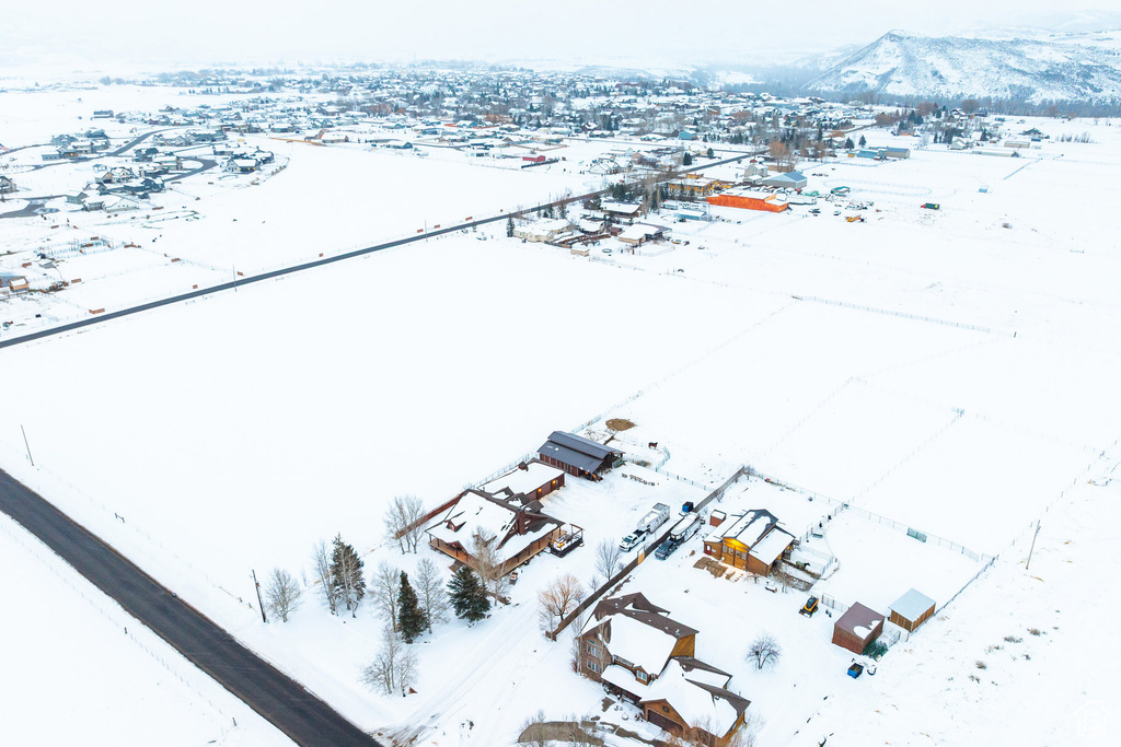 Snowy aerial view with a mountain view