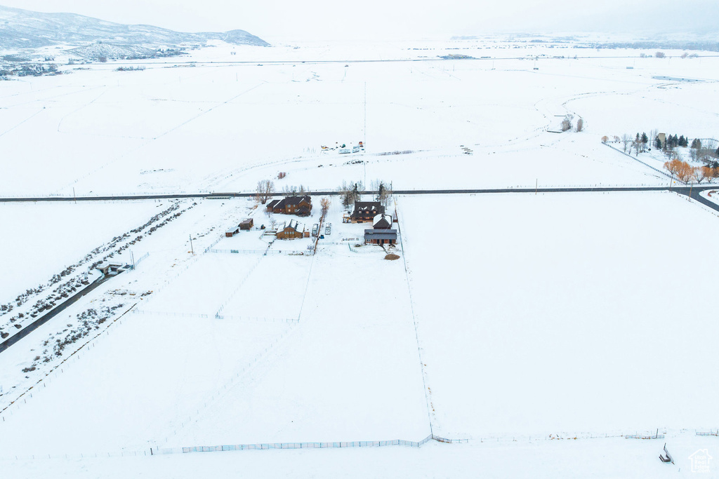 Snowy aerial view featuring a mountain view