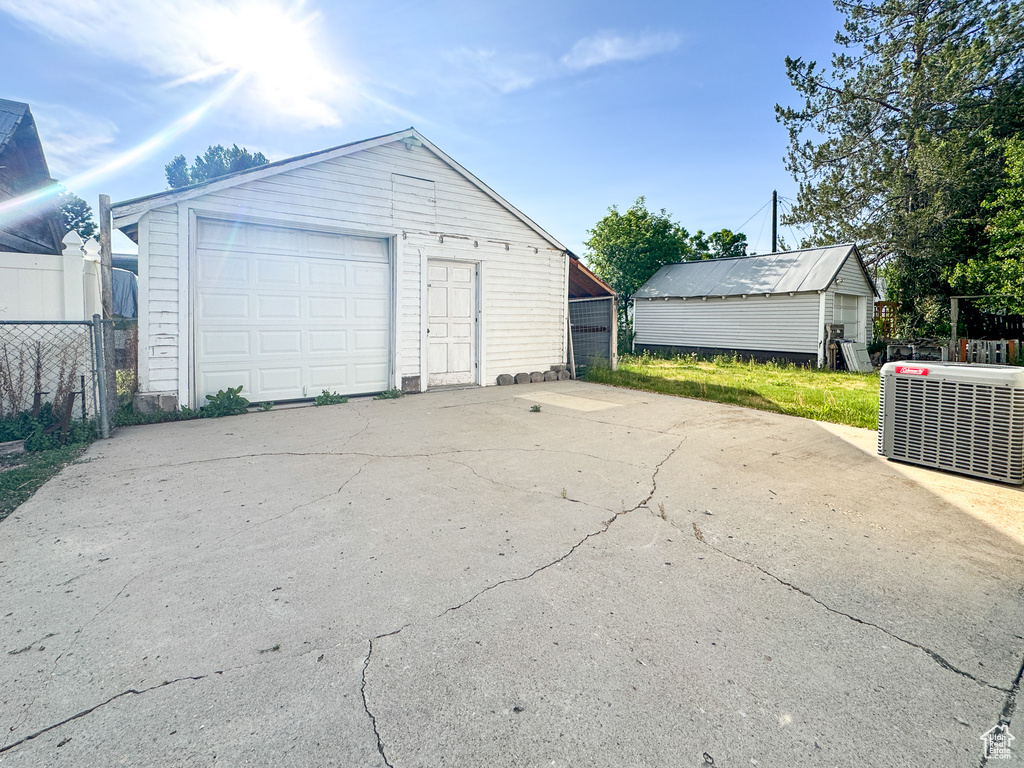 Detached garage with concrete driveway