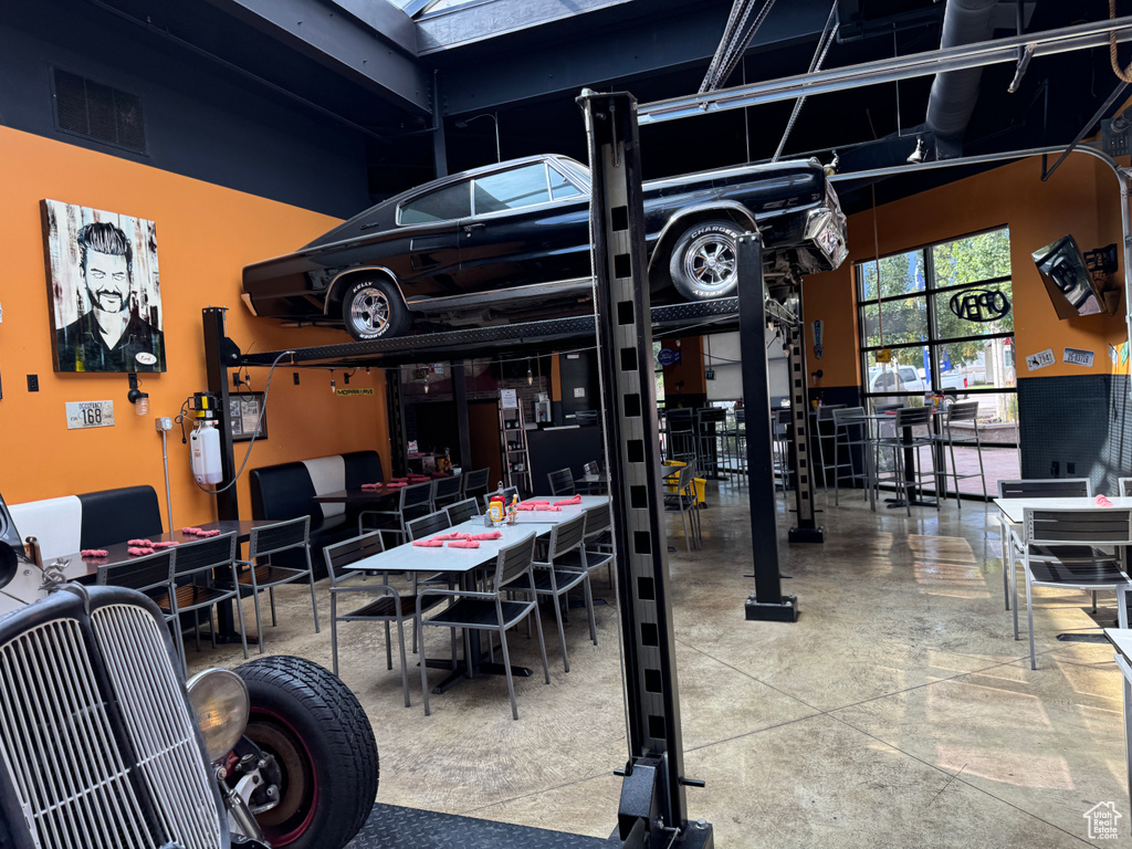 Dining area featuring visible vents and concrete floors