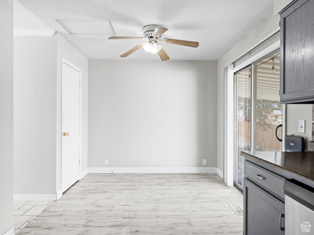 Interior space featuring light wood-type flooring, ceiling fan, and baseboards