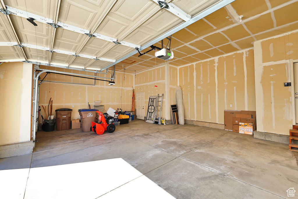 Garage featuring a garage door opener