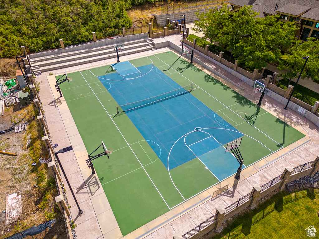 View of basketball court with community basketball court and fence