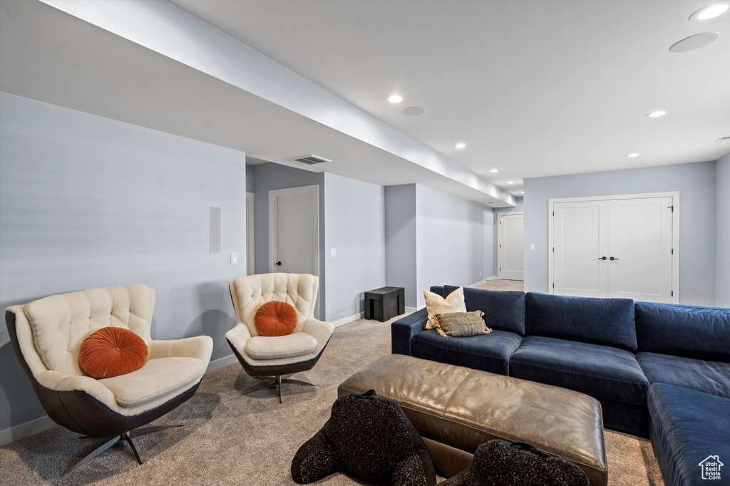 Living room featuring baseboards, carpet, visible vents, and recessed lighting