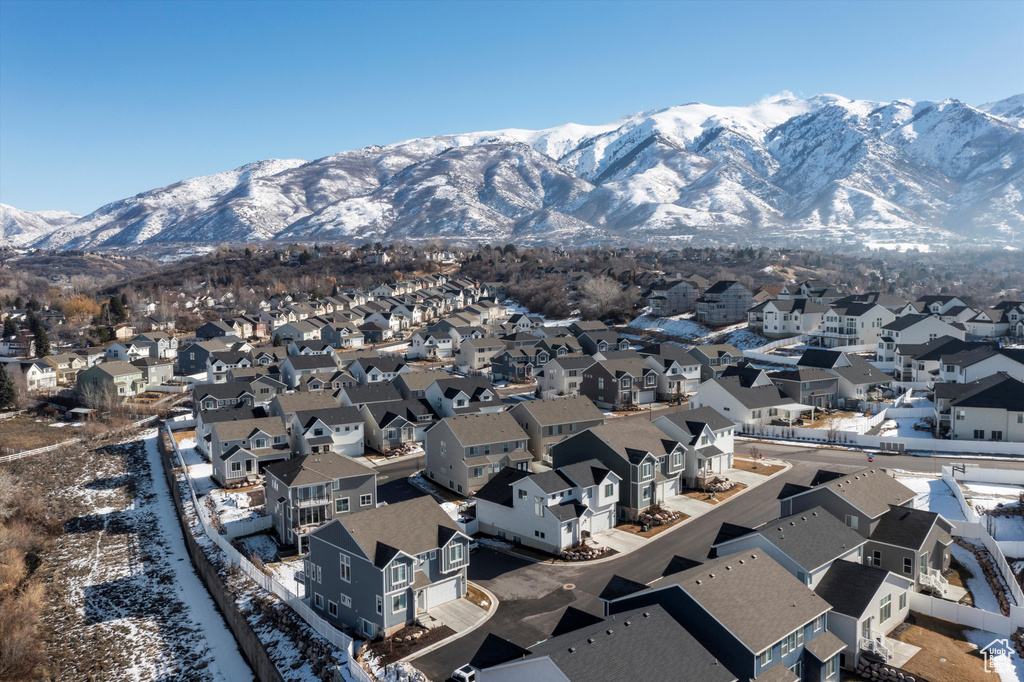 Property view of mountains with a residential view