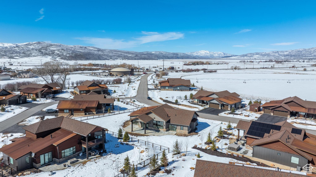 Snowy aerial view with a residential view and a mountain view