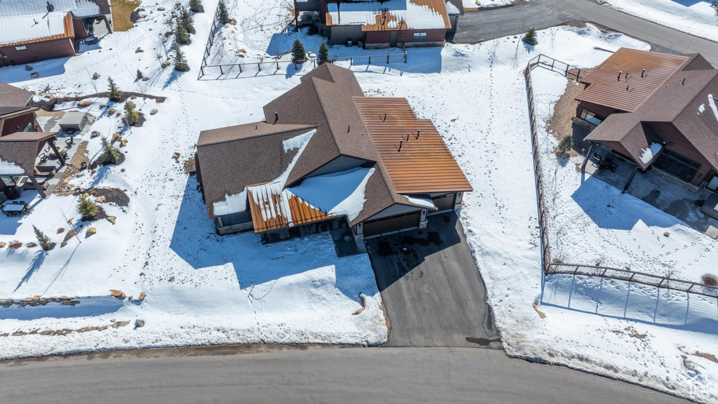 Snowy aerial view featuring a residential view