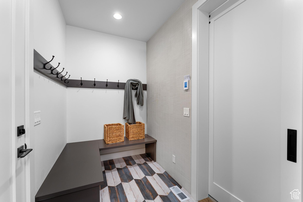 Mudroom featuring wood finished floors, visible vents, and recessed lighting