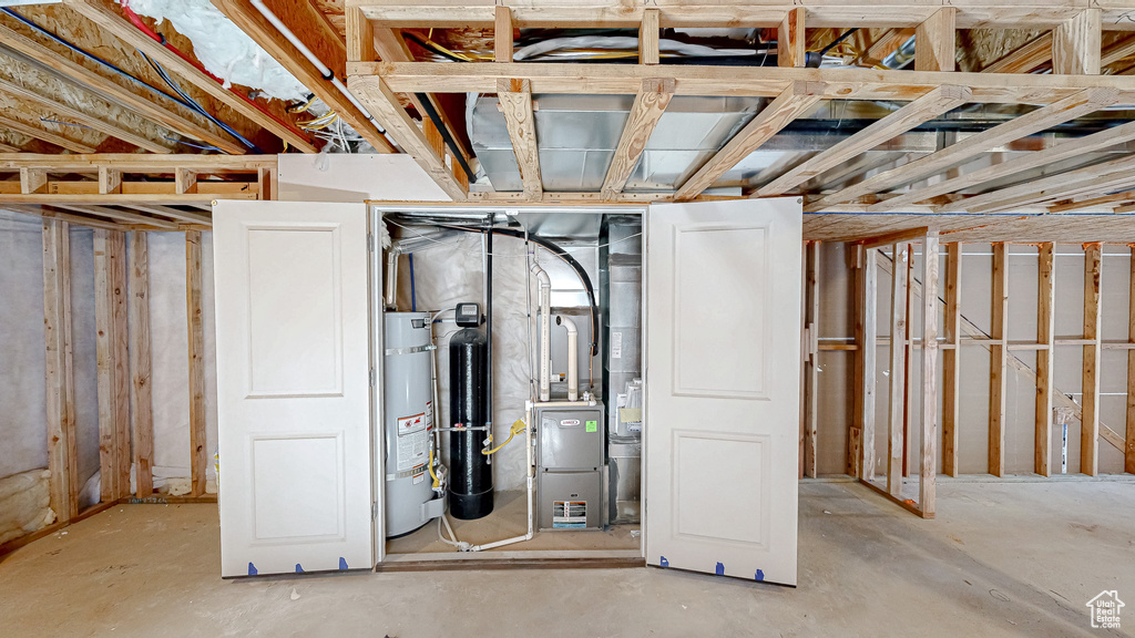 Unfinished basement with secured water heater and heating unit