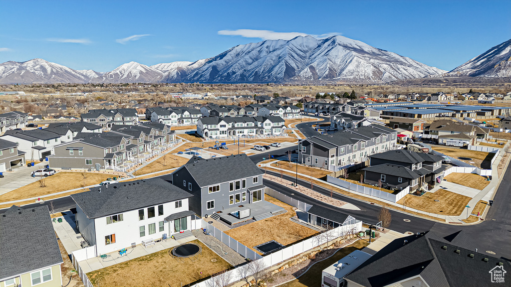 Property view of mountains with a residential view