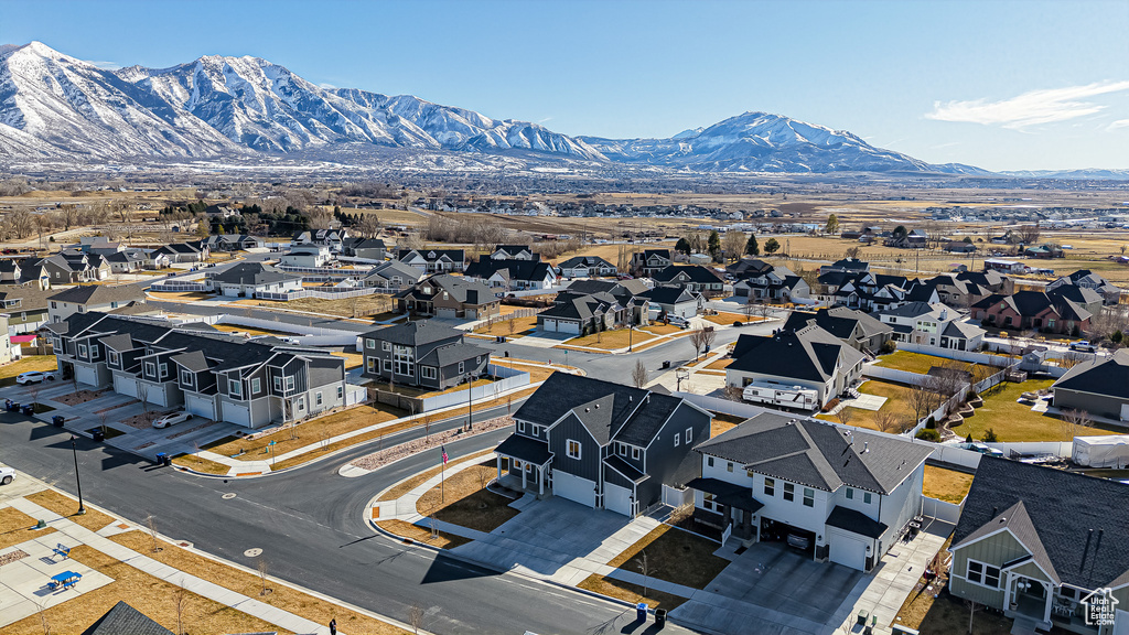 Birds eye view of property with a residential view and a mountain view