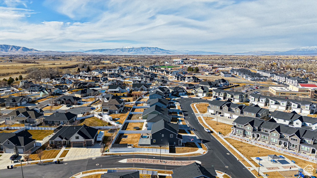 Drone / aerial view with a residential view and a mountain view