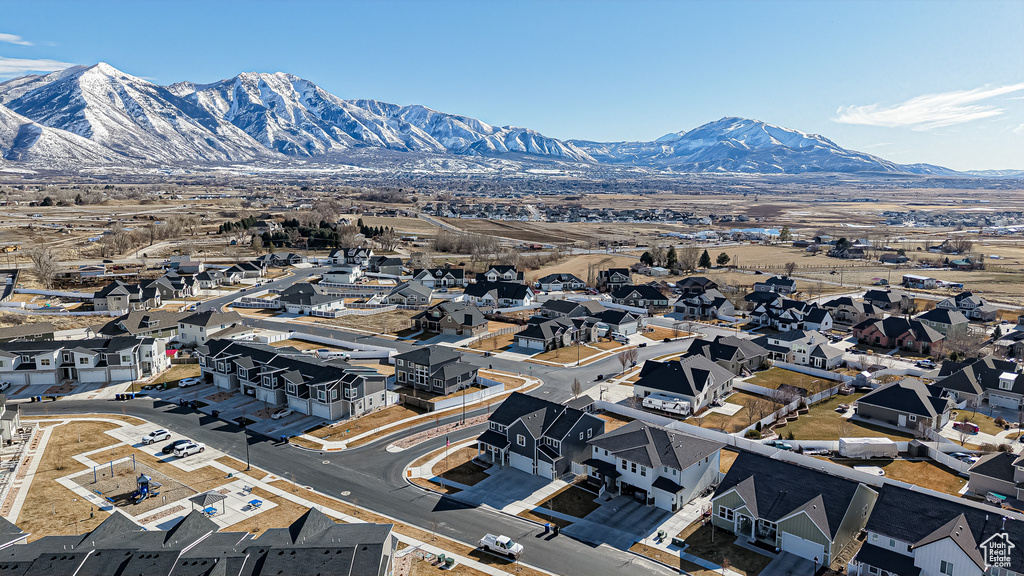 Drone / aerial view with a residential view and a mountain view