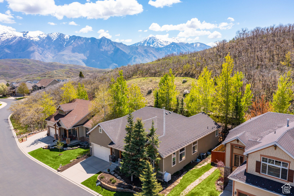 Aerial view of residential area featuring mountains