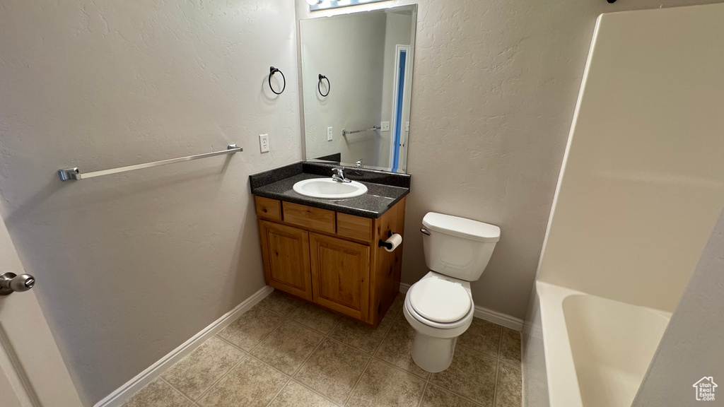 Bathroom with toilet, vanity, a shower, a bath, and tile patterned flooring