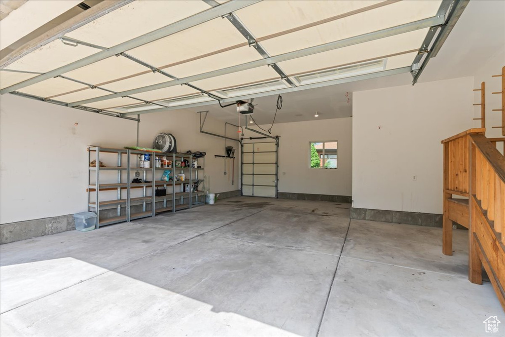 Garage featuring a garage door opener