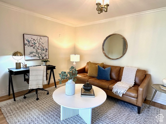 Living area featuring crown molding, baseboards, and wood finished floors