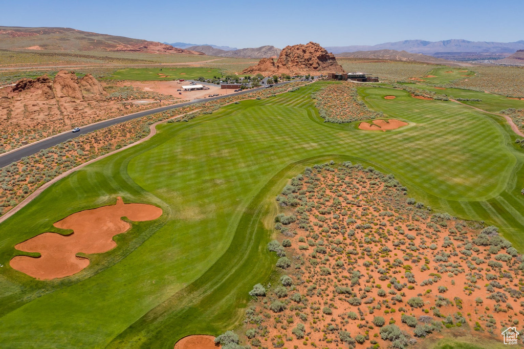 Bird\'s eye view with view of golf course and a mountain view