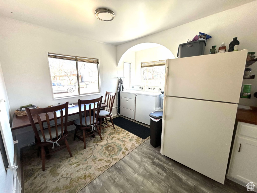 Dining room with washing machine and clothes dryer and wood finished floors