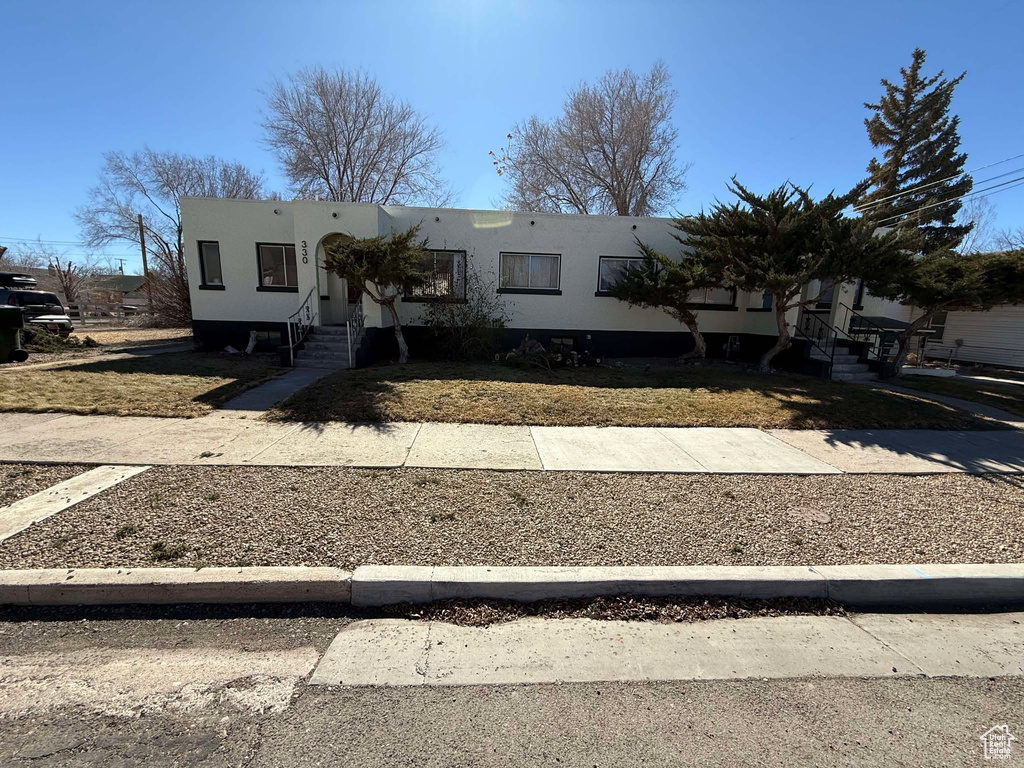 View of front of house featuring stucco siding