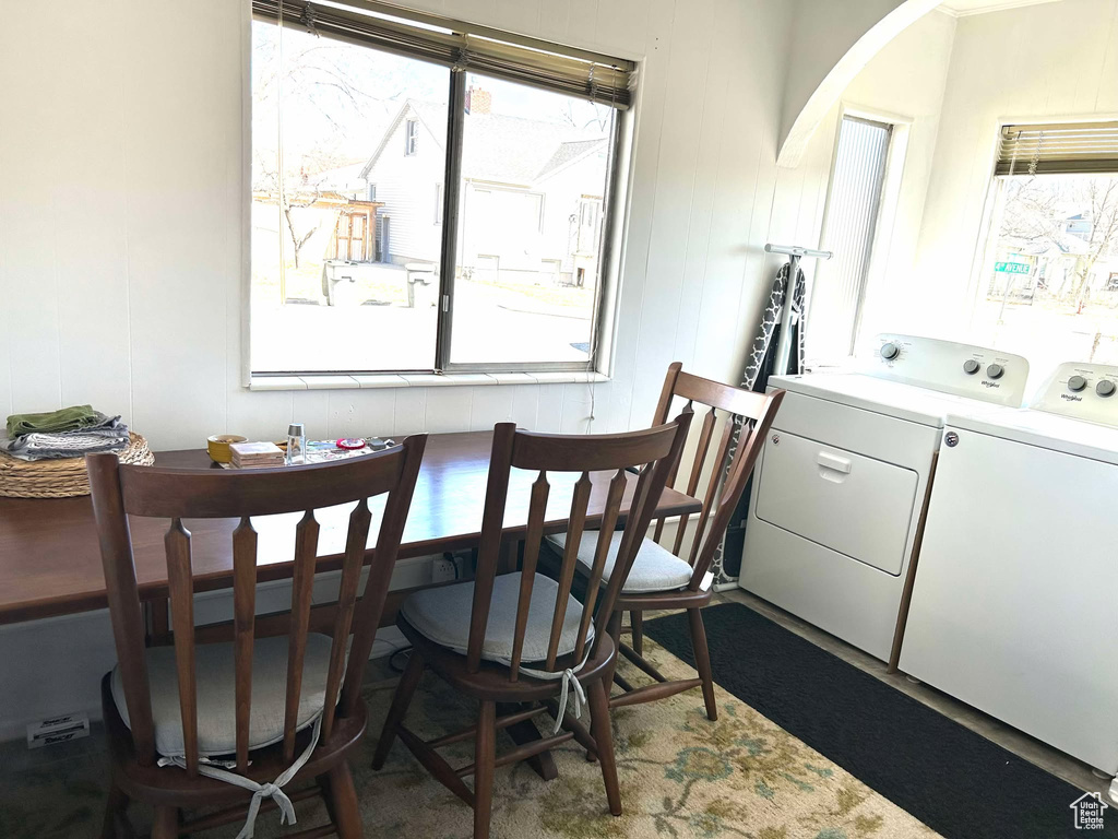 Dining room featuring washing machine and clothes dryer