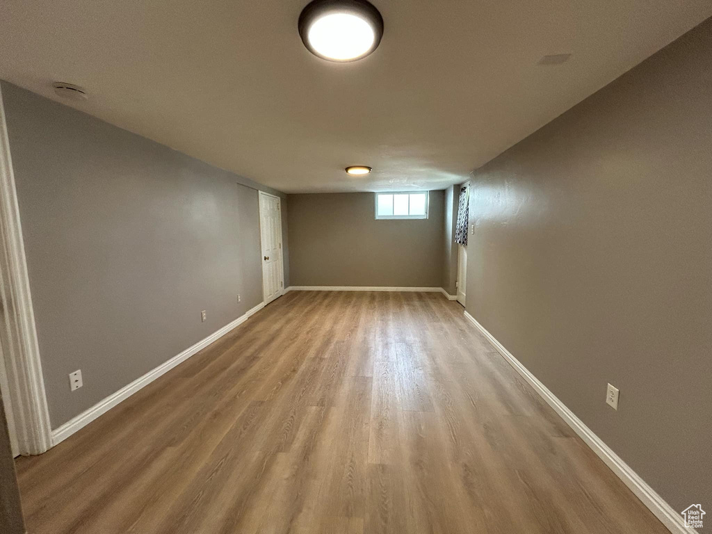 Below grade area with wood finished floors and baseboards