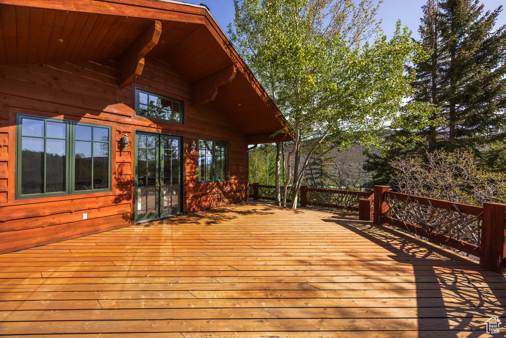 Wooden terrace featuring french doors