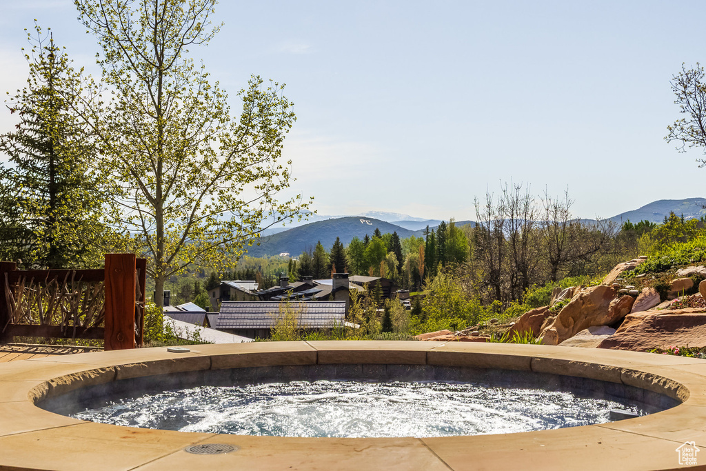 View of swimming pool with a mountain view