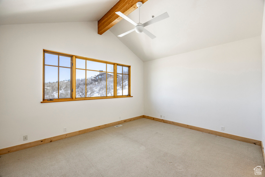 Unfurnished room with a ceiling fan, light carpet, and baseboards