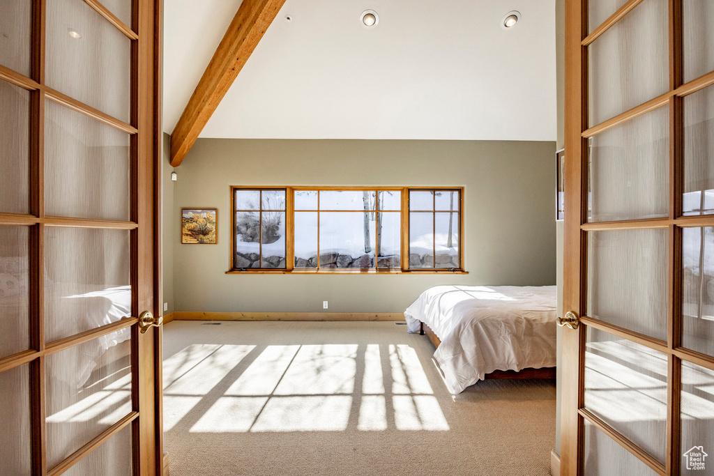 Bedroom featuring carpet, baseboards, and french doors