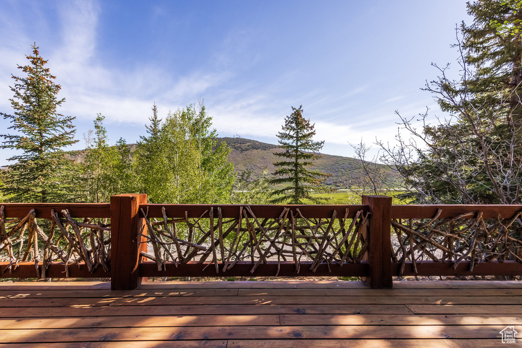 Wooden deck featuring a mountain view