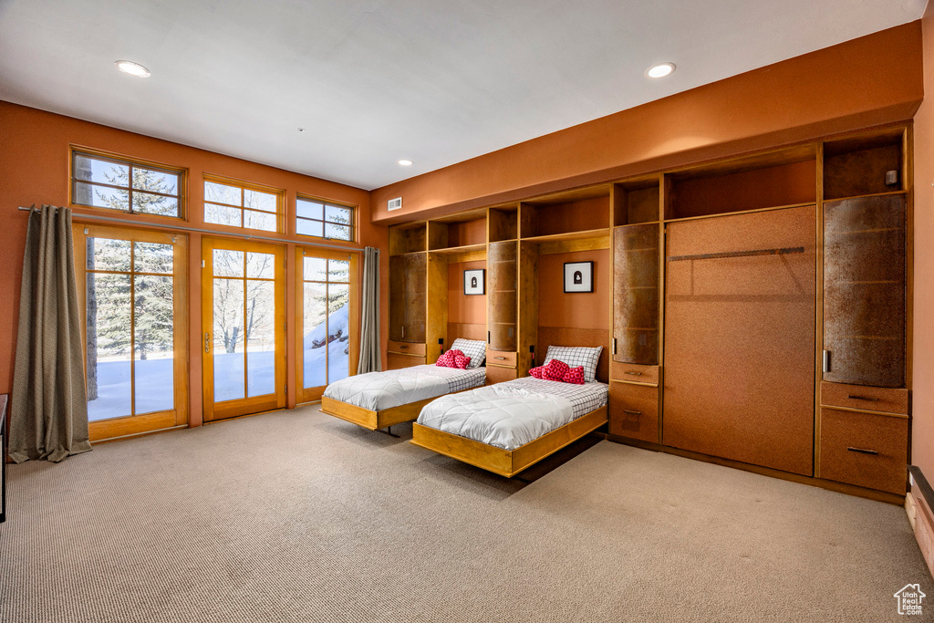 Bedroom with carpet flooring, access to outside, and recessed lighting
