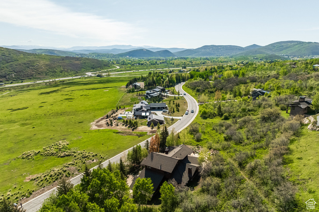 Aerial view of sparsely populated area featuring a mountainous background