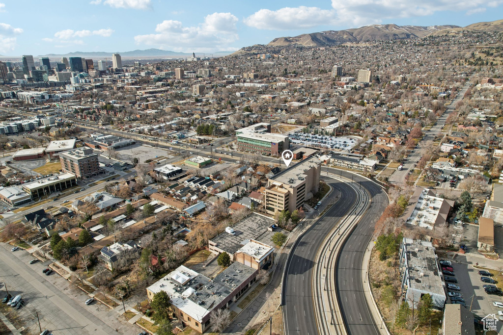 Birds eye view of property featuring a view of city and a mountain view