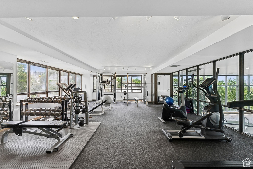 Exercise room with a textured ceiling