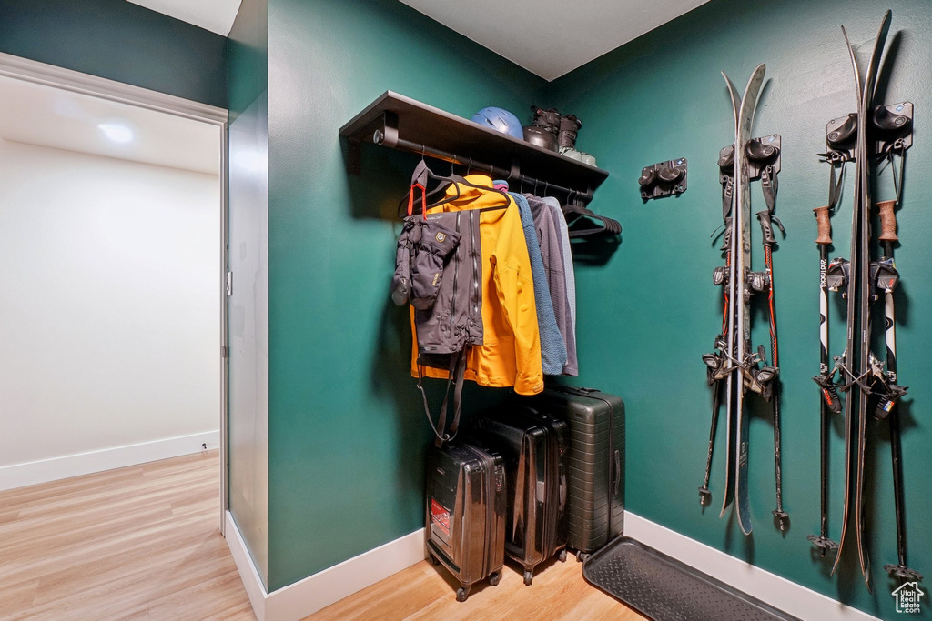 Mudroom featuring baseboards and wood finished floors