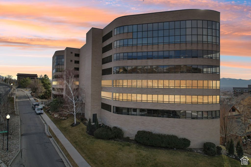 View of property at dusk