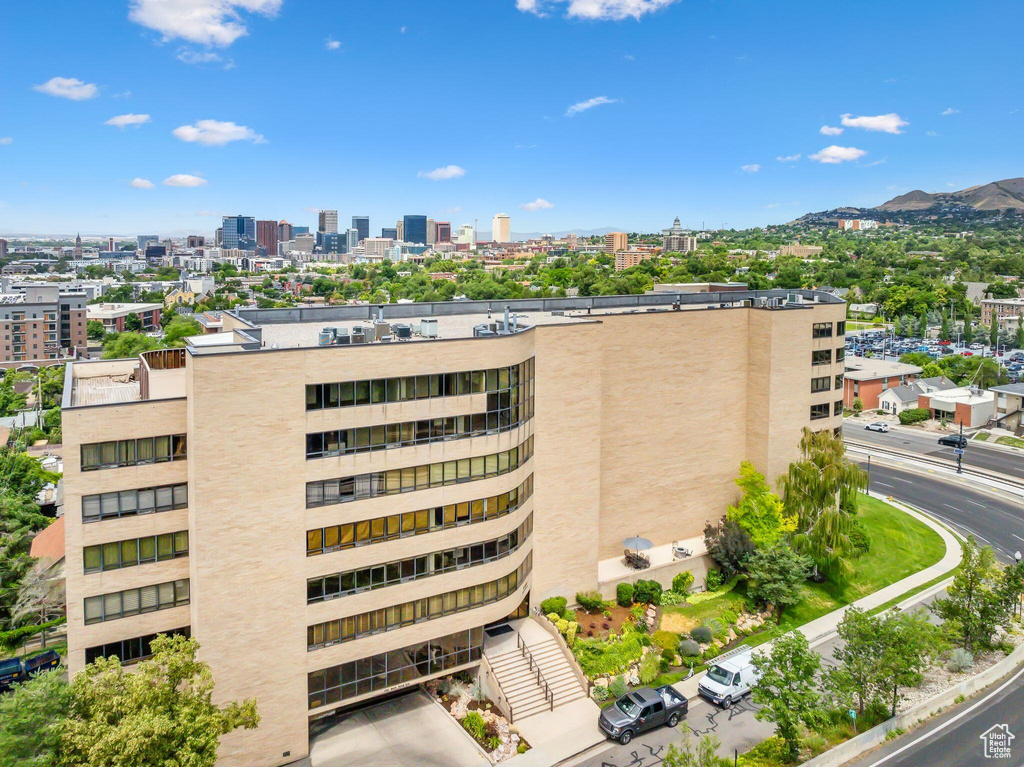 View of property with a mountain view and a city view