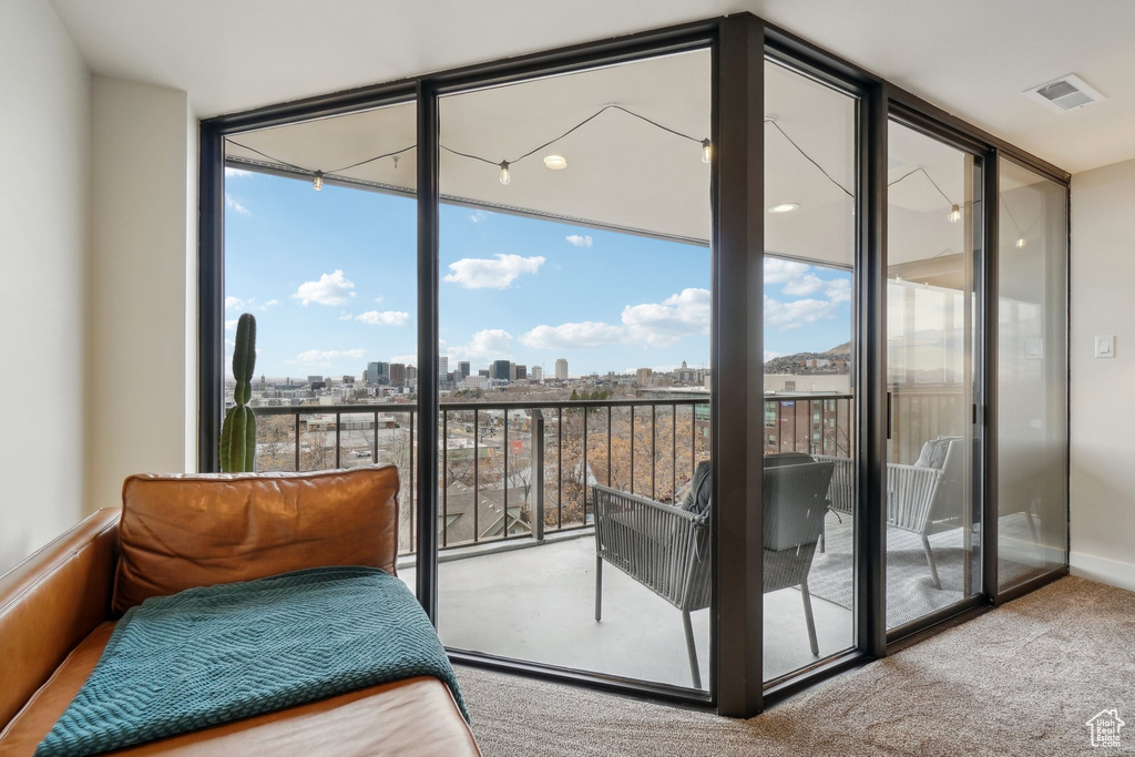 Interior space featuring a view of city and visible vents