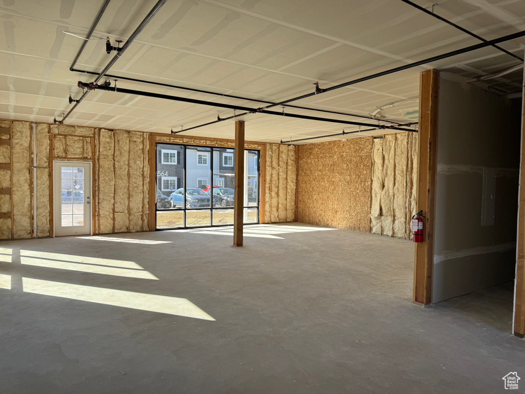 Interior space featuring a garage and concrete floors