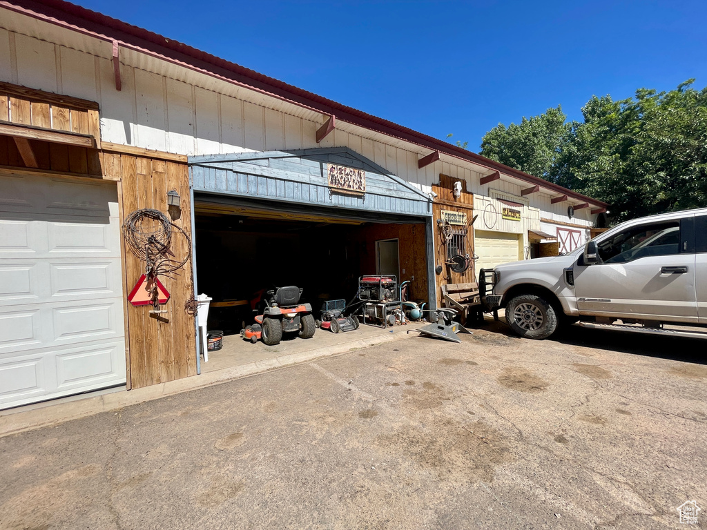 Garage featuring driveway