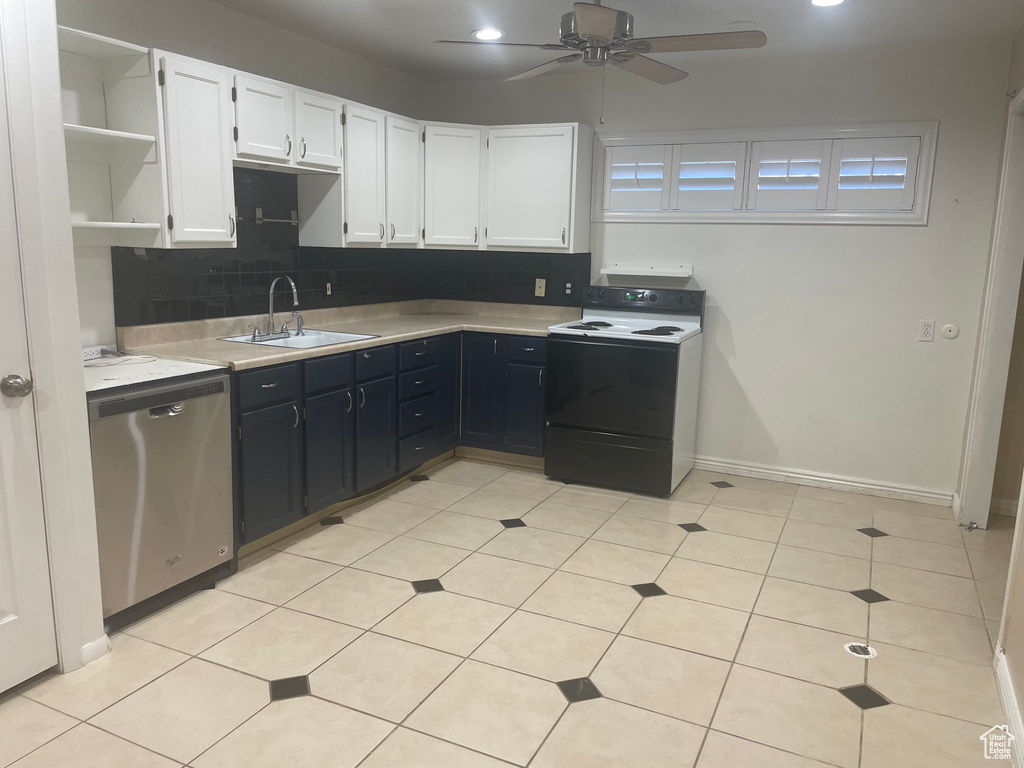 Kitchen featuring range with electric stovetop, white cabinets, stainless steel dishwasher, backsplash, and sink