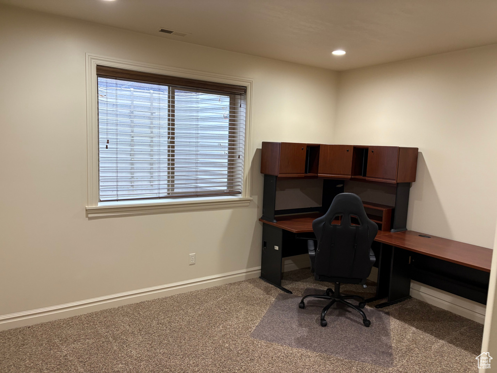 Office space with recessed lighting, carpet flooring, visible vents, and baseboards