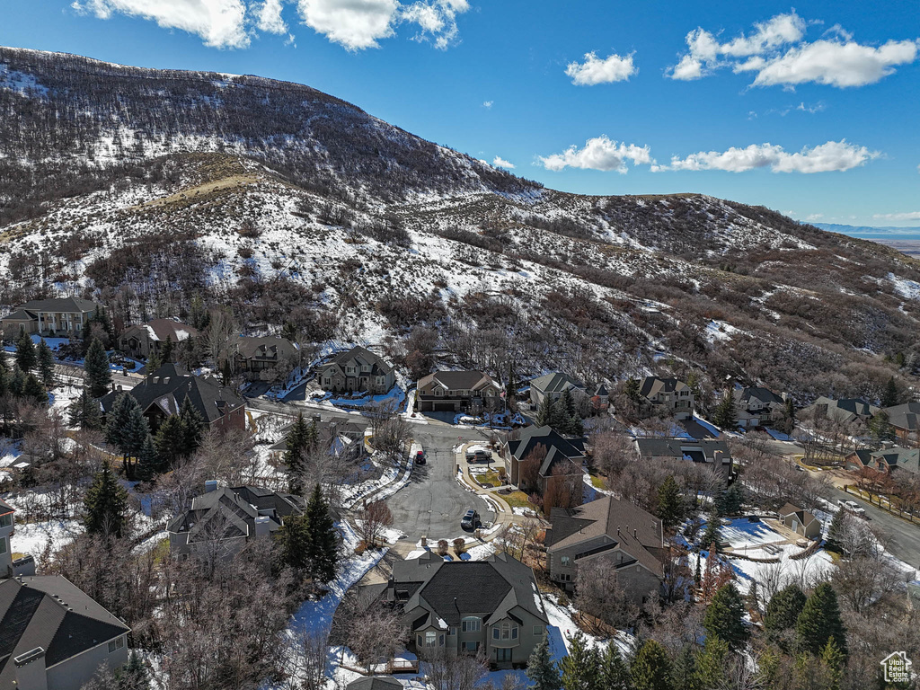 Snowy aerial view with a residential view and a mountain view