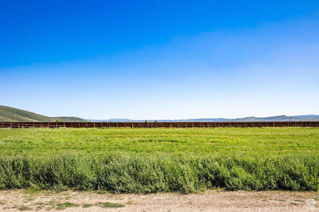 View of nature featuring a rural view and a mountain view