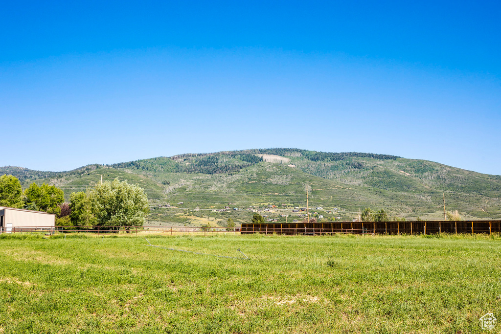 Property view of mountains with a rural view