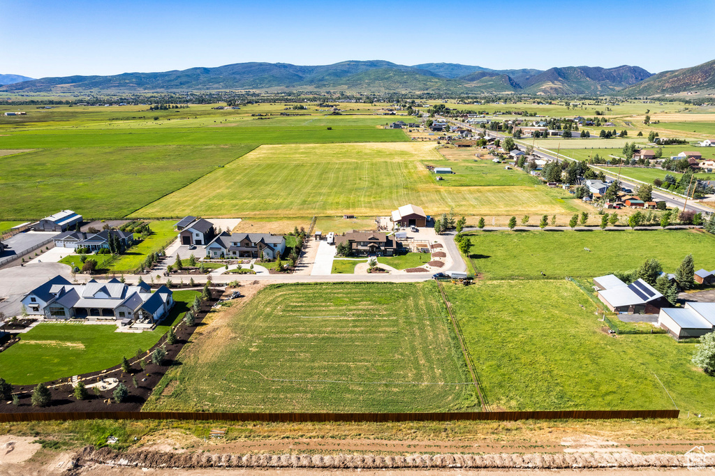 Birds eye view of property featuring a residential view, a mountain view, and a rural view
